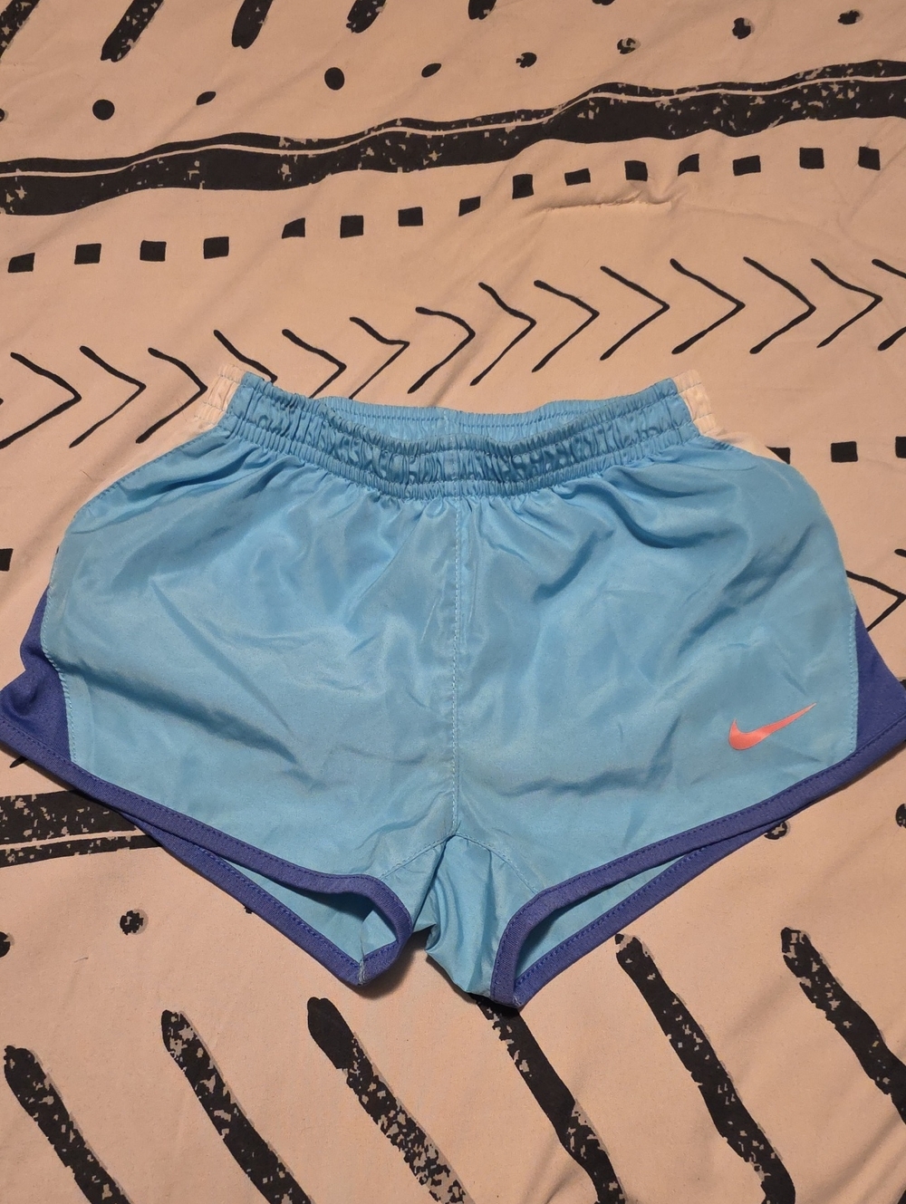 Nike Kids Sky Blue Running Shorts with Purple/blue Trim and Coral Swoosh